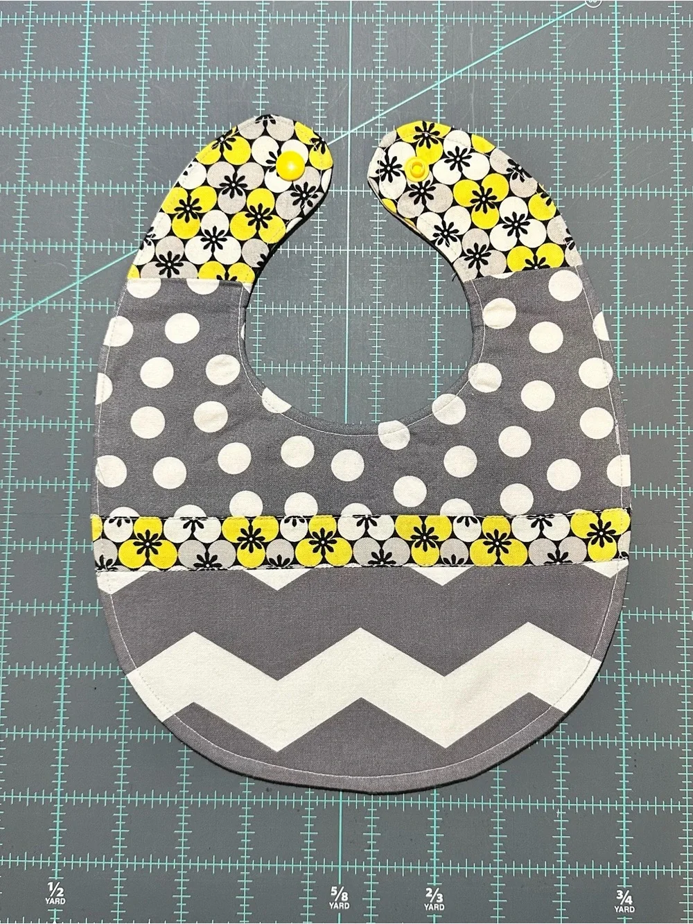 Gray Chevron Baby Bib and Diaper Pouch with Yellow Floral Accent